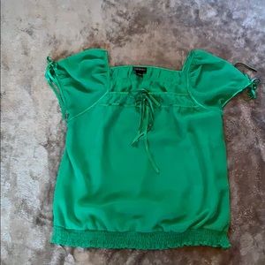 Sheer blouse with elastic waist.